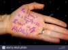 maths-formulas-written-on-the-palm-of-a-hand-in-purple-ink-EM8C8B.jpg