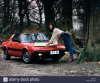 young-woman-with-her-fiat-x19-sports-car-1983-D3JF3C.jpg