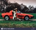 young-woman-with-her-fiat-x19-sports-car-1983-D3JF4R.jpg